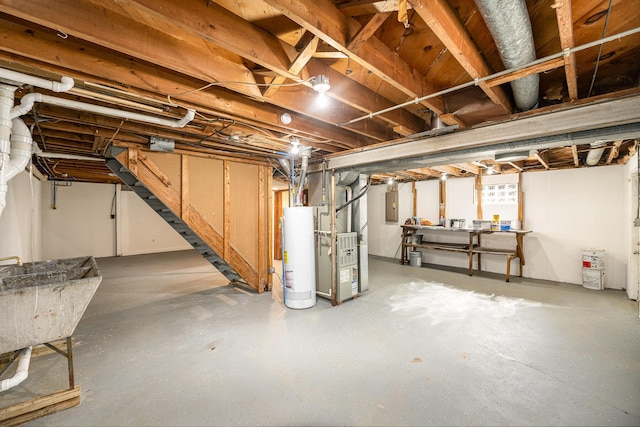 unfinished below grade area featuring heating unit, electric panel, water heater, and a sink