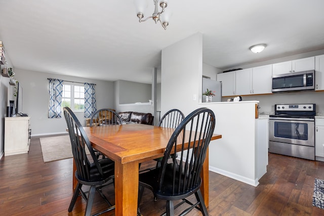 dining space with baseboards, a chandelier, and dark wood-style flooring