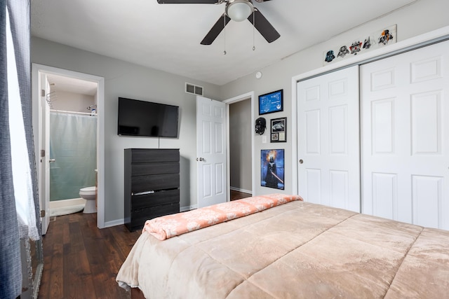 bedroom featuring visible vents, dark wood-type flooring, baseboards, a closet, and ensuite bath