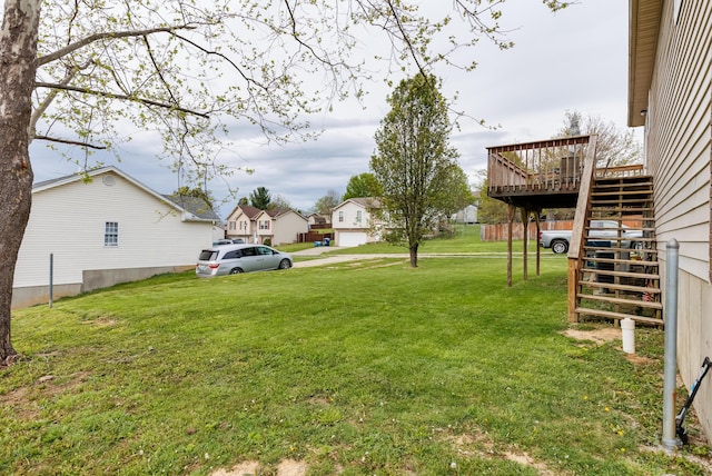 view of yard with stairway and a wooden deck