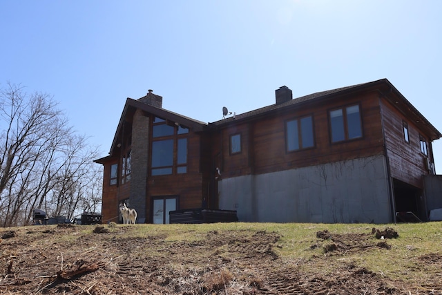 back of property featuring a chimney