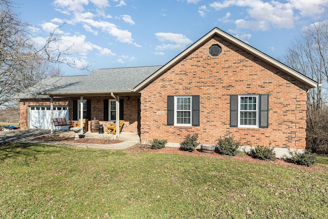 ranch-style home with brick siding, a front yard, a garage, and roof with shingles