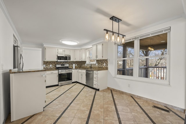 kitchen featuring crown molding, light tile patterned floors, visible vents, and appliances with stainless steel finishes