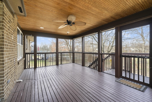 unfurnished sunroom featuring ceiling fan and wooden ceiling