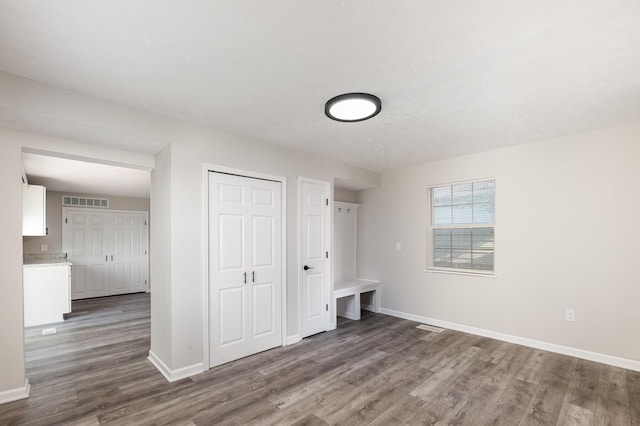 29 Race St, Dry Ridge, KY 41035 - unfurnished bedroom with dark wood-type flooring and a closet