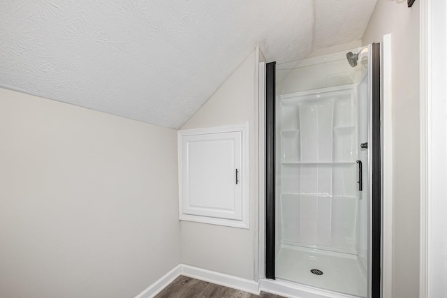 29 Race St, Dry Ridge, KY 41035 - bathroom featuring lofted ceiling, a shower stall, wood finished floors, and a textured ceiling