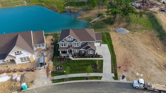 bird's eye view with a water view