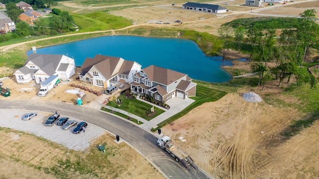 bird's eye view featuring a water view and a residential view