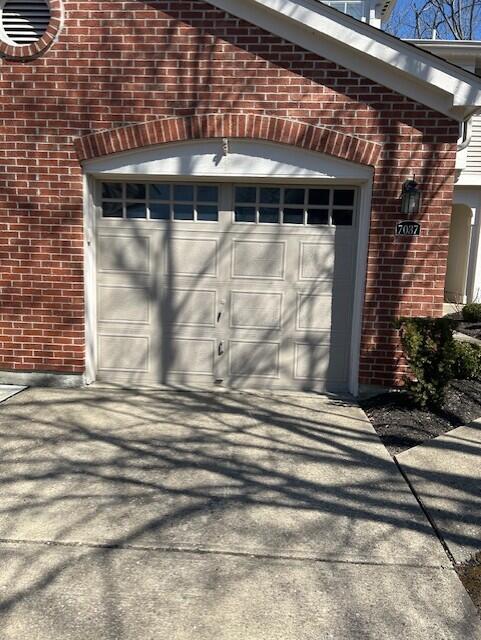 garage with concrete driveway