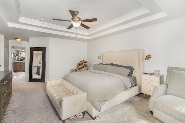 bedroom featuring light carpet, crown molding, a raised ceiling, and ceiling fan