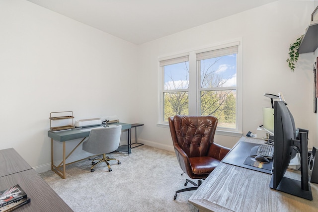 office featuring baseboards and carpet flooring