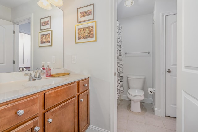 full bath with tile patterned flooring, toilet, vanity, and baseboards