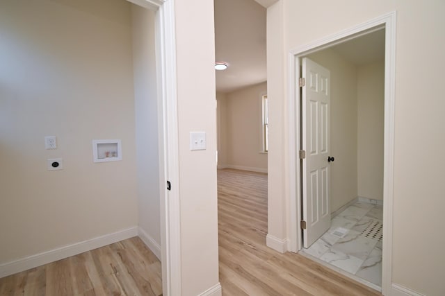 laundry room with baseboards, washer hookup, laundry area, light wood-style flooring, and hookup for an electric dryer