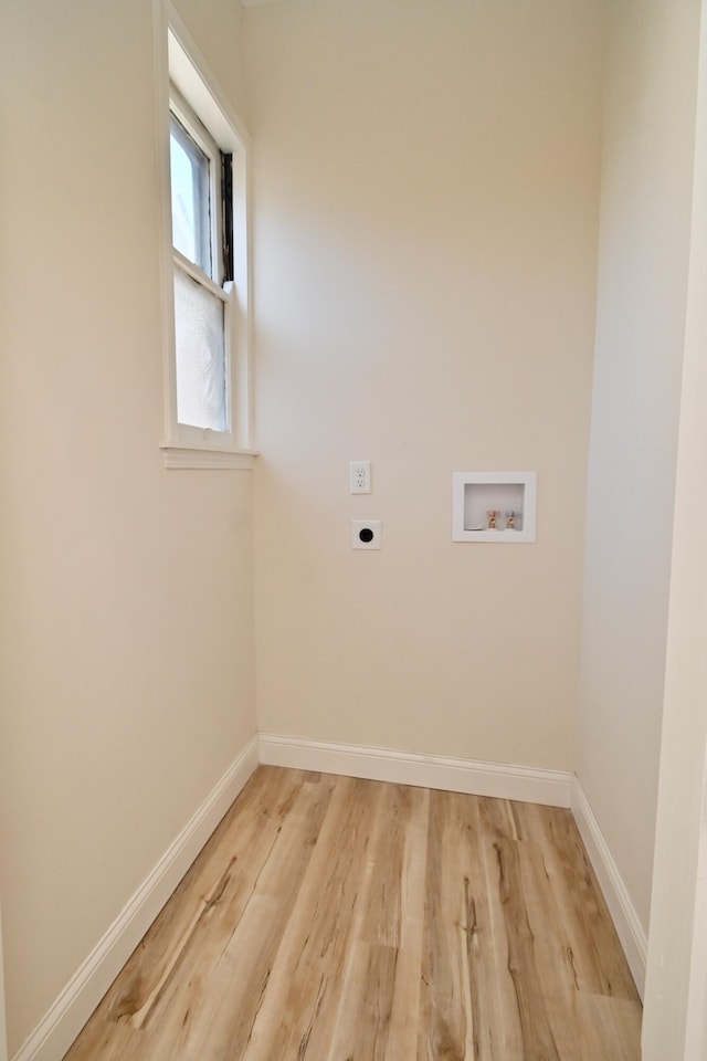 clothes washing area featuring laundry area, hookup for a washing machine, baseboards, and electric dryer hookup