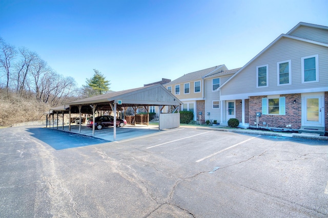 view of partially covered parking lot