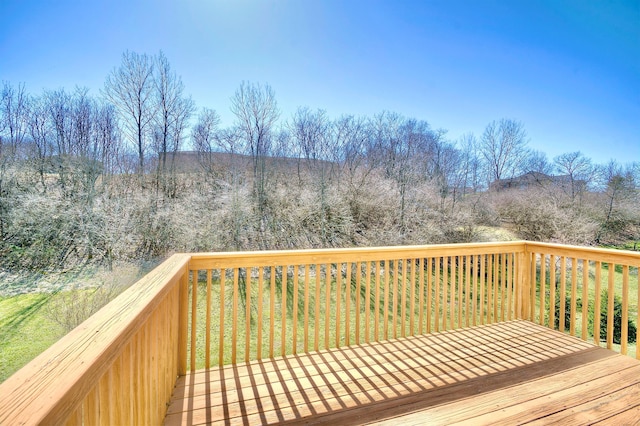 deck featuring a wooded view