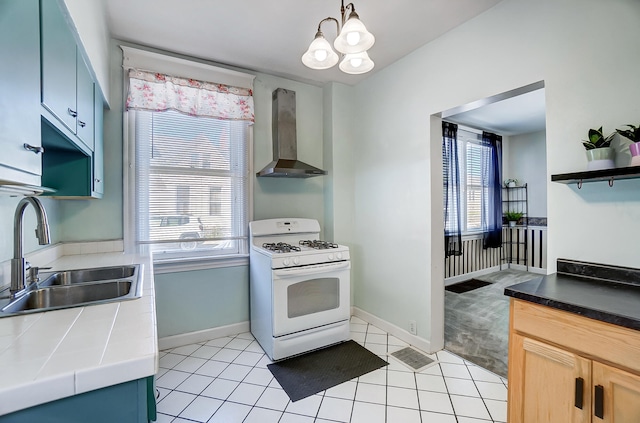 kitchen with white range with gas cooktop, wall chimney range hood, open shelves, and a sink