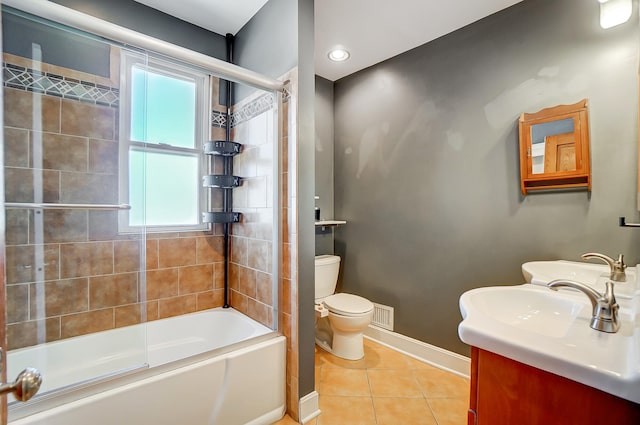 full bath featuring baseboards, visible vents, shower / bath combination with glass door, tile patterned floors, and toilet