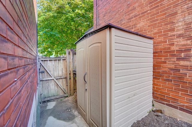 view of outdoor structure with a gate and fence