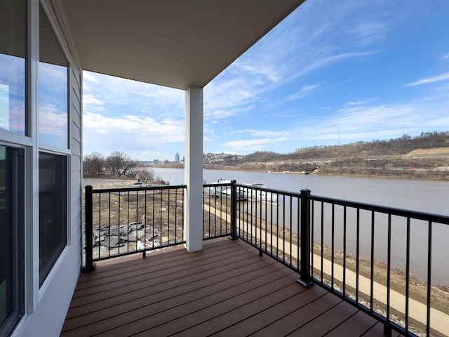 wooden deck featuring a water view