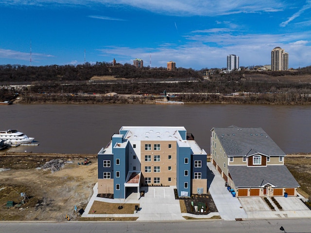 birds eye view of property featuring a water view