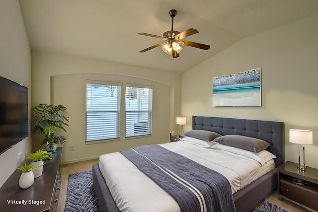 bedroom with carpet floors, a ceiling fan, and vaulted ceiling