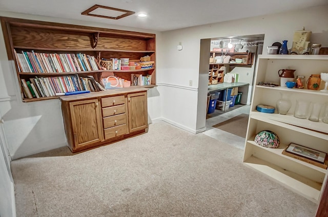 interior space featuring recessed lighting, light colored carpet, and attic access