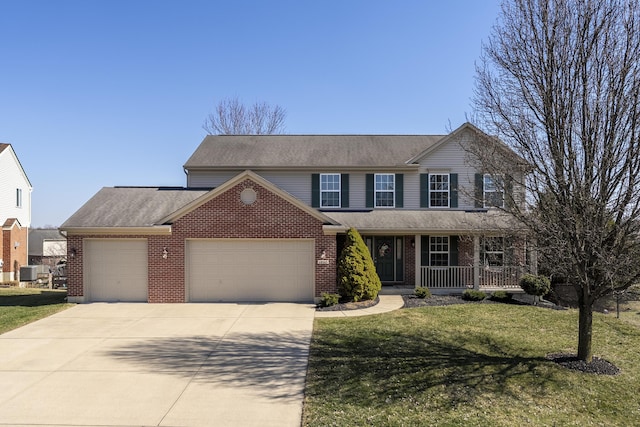 traditional-style home with a front yard, brick siding, a porch, and an attached garage