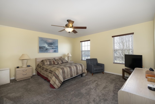 carpeted bedroom featuring a ceiling fan and baseboards