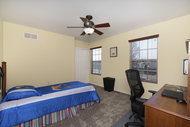 carpeted bedroom with visible vents, ceiling fan, and baseboards