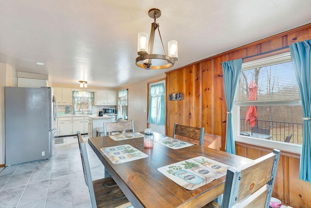 dining room featuring a notable chandelier