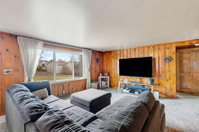 living room featuring light colored carpet and wood walls