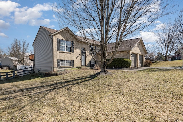 view of front of home featuring a front lawn, an attached garage, fence, and brick siding