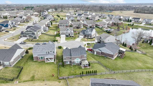 aerial view with a residential view and a water view