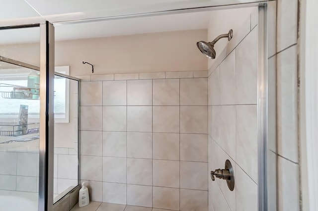 full bathroom with tiled shower