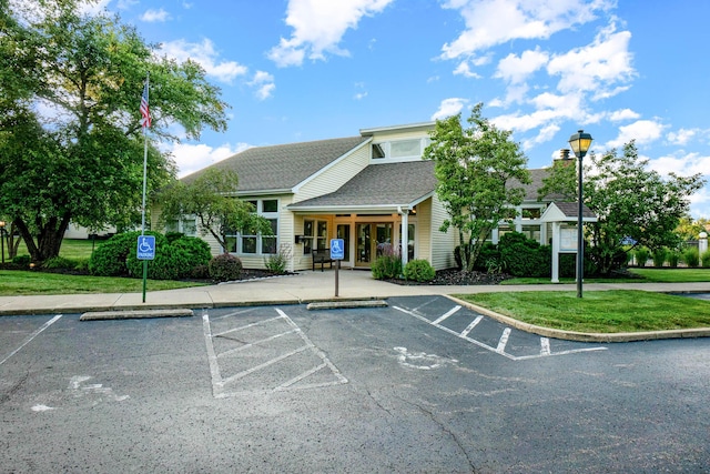 view of property with uncovered parking