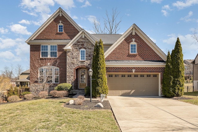 traditional-style home with brick siding, a front lawn, a garage, stone siding, and driveway