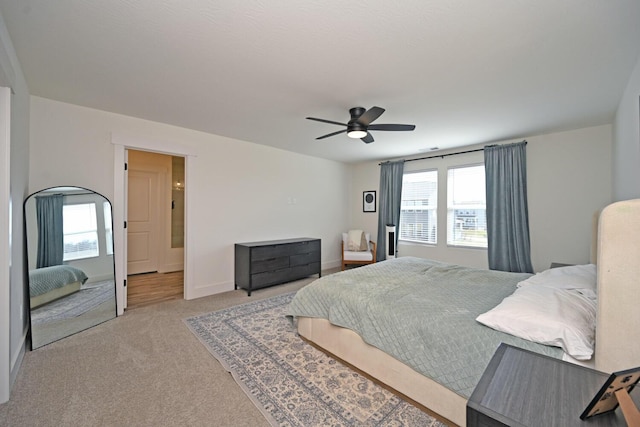 bedroom with carpet flooring, baseboards, and ceiling fan