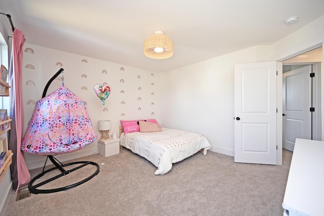 carpeted bedroom with baseboards