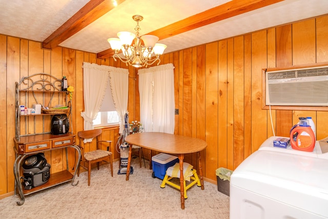 office area featuring beamed ceiling, a notable chandelier, carpet, and wood walls