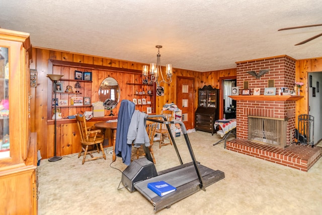 office space featuring a brick fireplace, a textured ceiling, and carpet floors