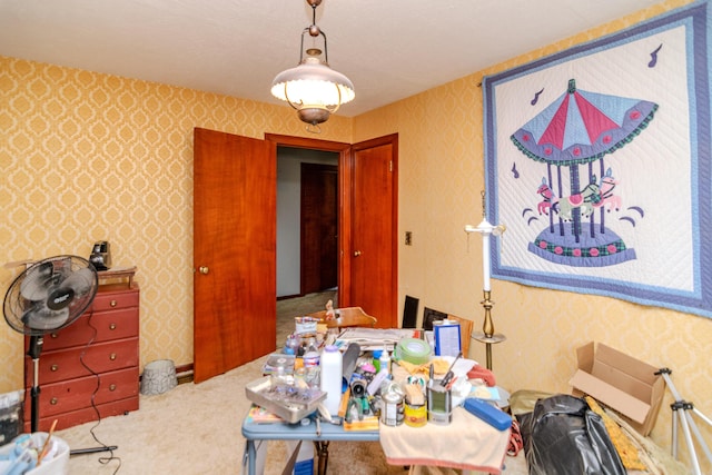 dining room featuring carpet flooring and wallpapered walls