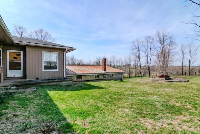view of yard with a fire pit