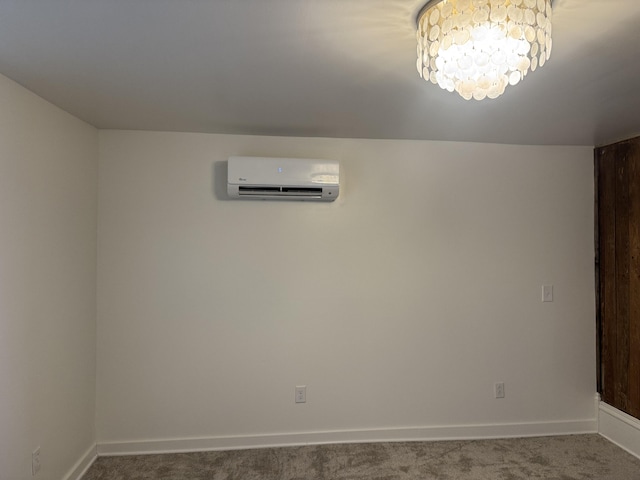 carpeted empty room with baseboards, an inviting chandelier, and a wall mounted AC