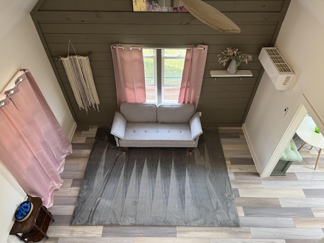 interior space featuring baseboards and wood finished floors