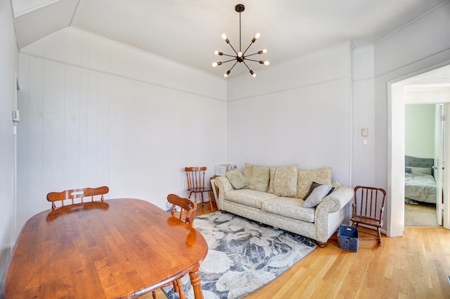 living area featuring wood finished floors and a chandelier