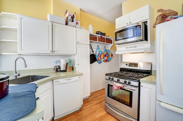 kitchen featuring open shelves, white cabinets, under cabinet range hood, and stainless steel appliances