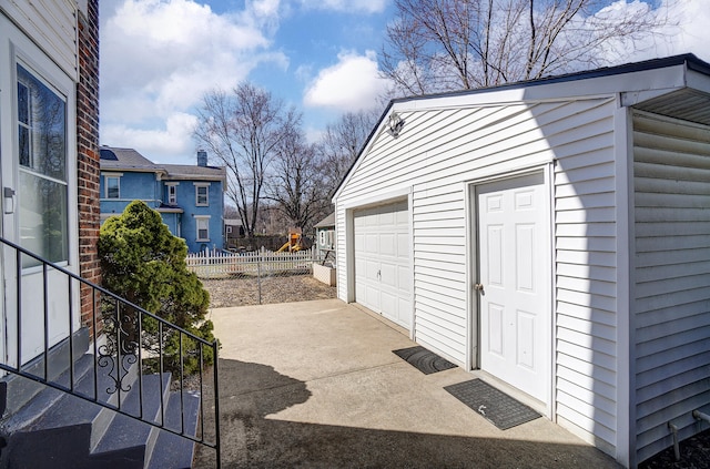 detached garage with fence