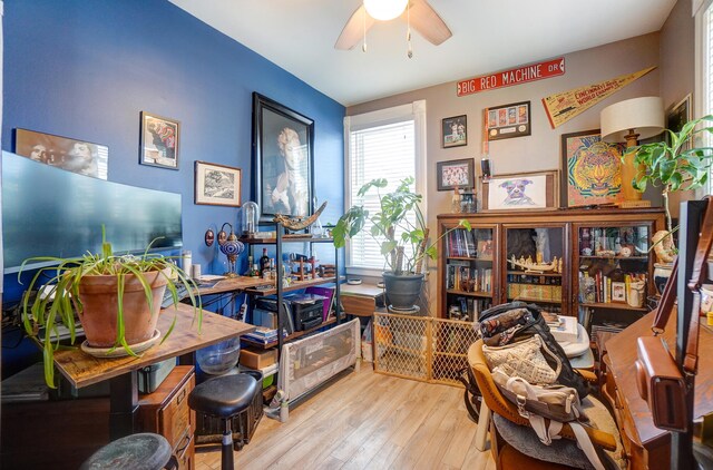 office with a ceiling fan and wood finished floors