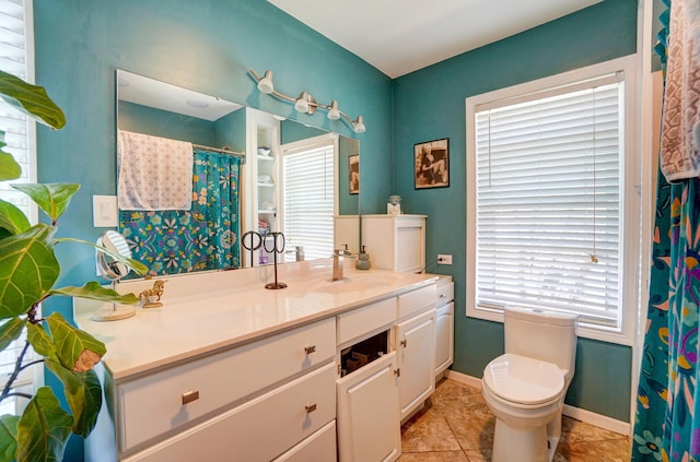 bathroom featuring tile patterned floors, toilet, curtained shower, baseboards, and vanity